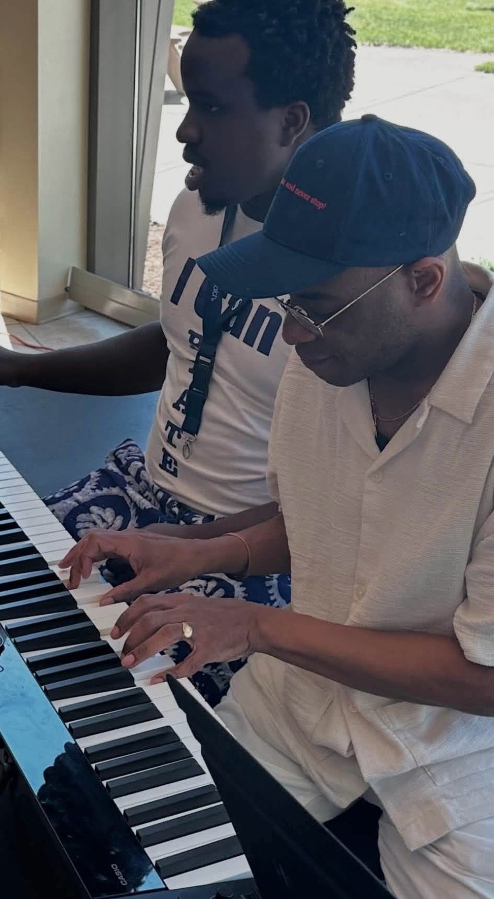 Stephen Wiltshire sharing a musical moment at the keyboard during the Wisconsin visit