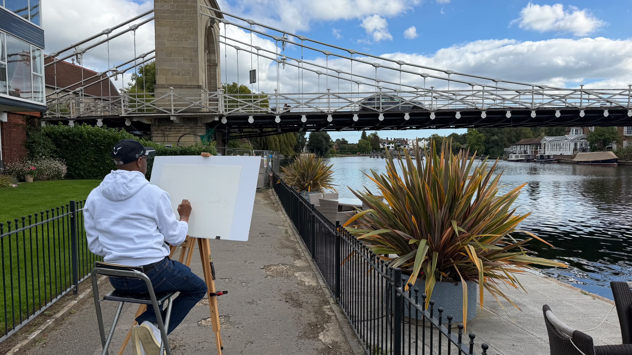 Wide view of Stephen Wiltshire drawing Marlow Bridge beside the Thames