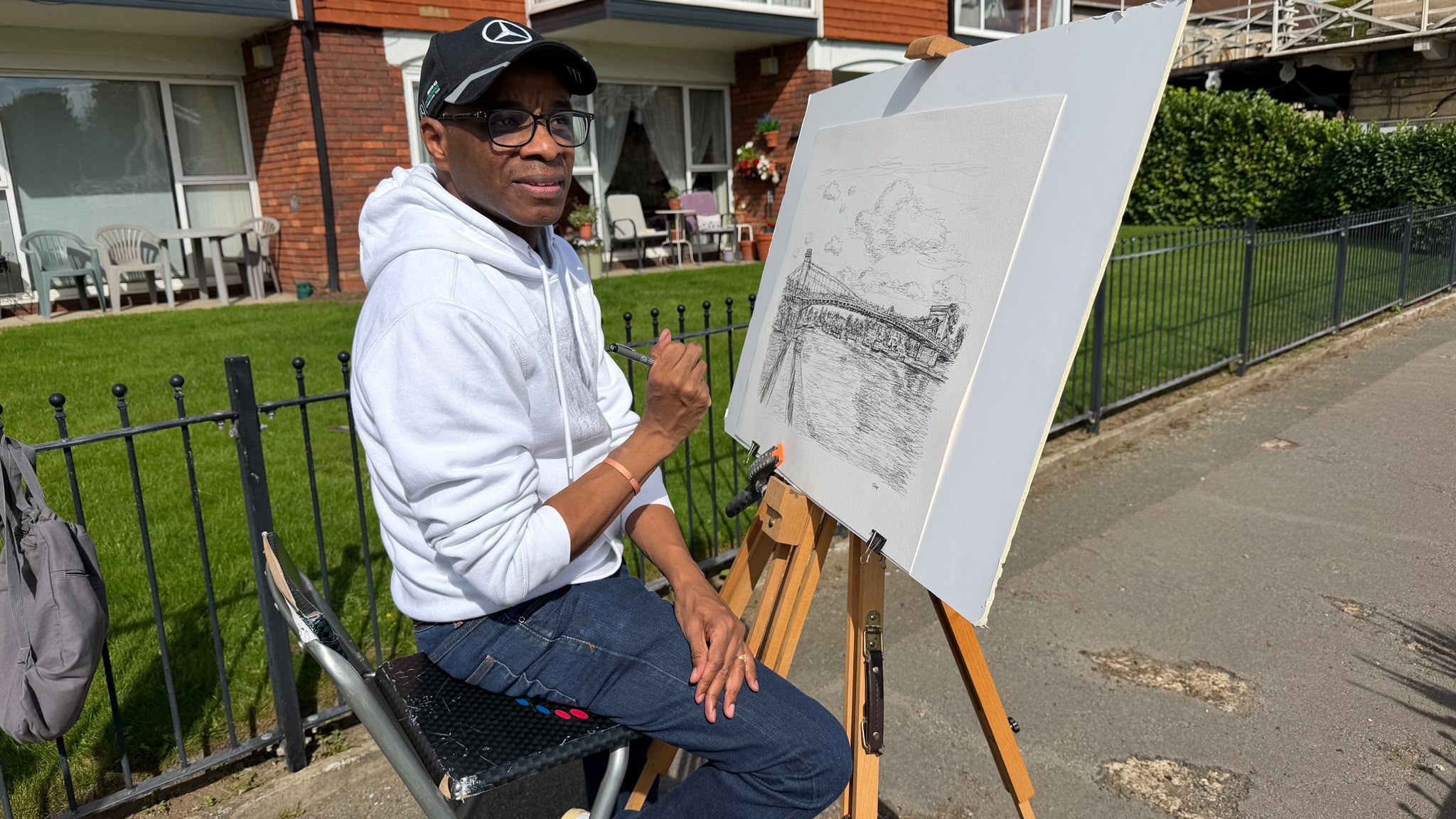 Stephen Wiltshire with his completed drawing of Marlow Bridge