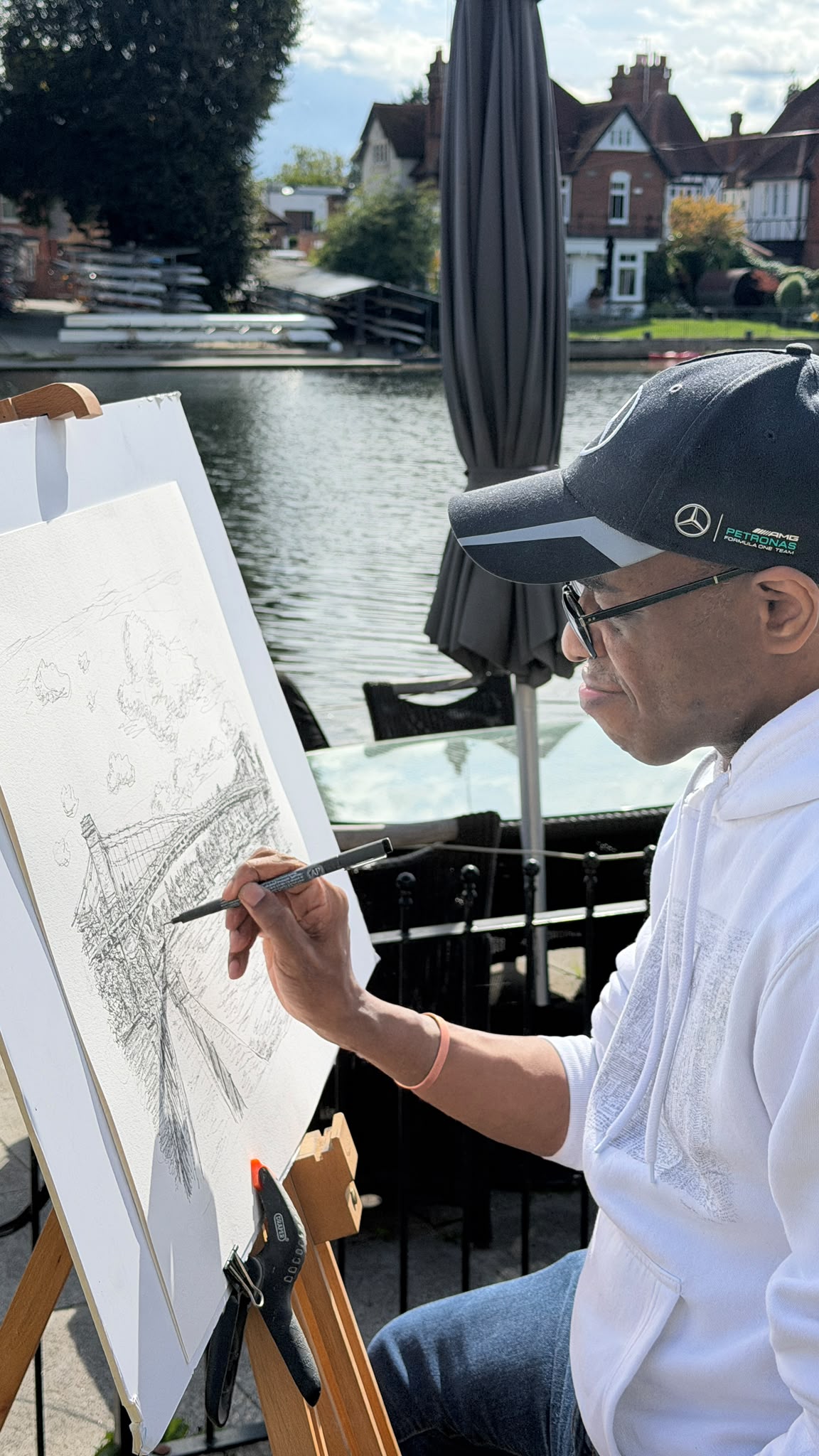 Close-up of Stephen Wiltshire drawing Marlow Bridge in pen and ink